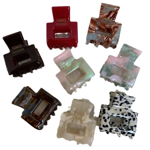 Minimalist square hair claw clips set in various colorful marbled acetate patterns