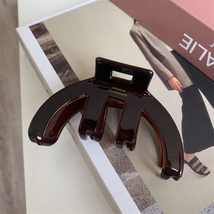 French vintage brown acetate claw clip with gold label for elegant hair styling