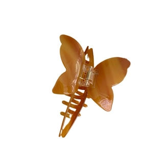 Elegant amber butterfly hair claw clip with acetate texture and handmade craftsmanship