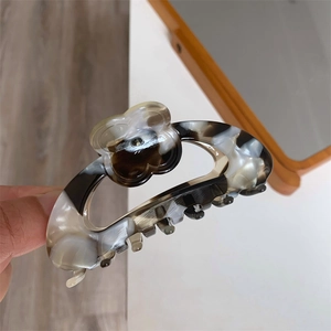 Floral tortoiseshell marble hair claw clip with acetate resin flower detail