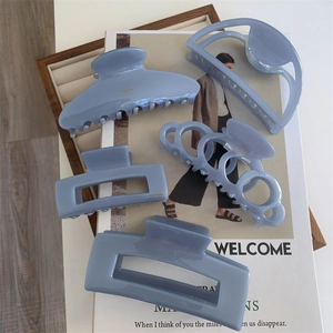 Five-piece set of light blue acetate hair claws in various elegant geometric shapes