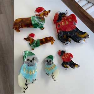Festive Christmas dog hair claws featuring dachshunds and pugs in colorful acetate finish