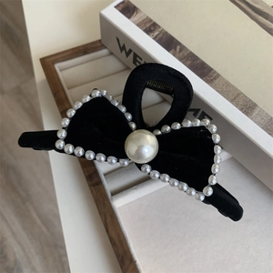 Elegant black velvet bow hair claw clip with pearl trim and large center pearl
