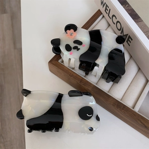 Detailed view of panda-shaped hair claw clips made of premium acetate with floral accents