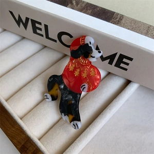 Detail of Bernese Mountain Dog hair claw clip in festive Christmas sweater design
