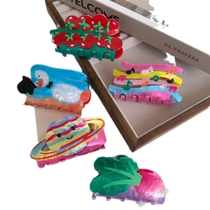 Creative colorful acrylic hair claw clips set featuring strawberry penguin and planet shapes