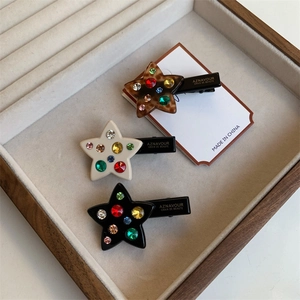 Lot de trois barrettes à cheveux en forme d'étoile avec strass colorés en couleurs variées