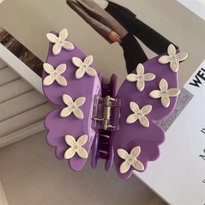 Pince à cheveux papillon violette élégante avec fleurs blanches et strass brillants