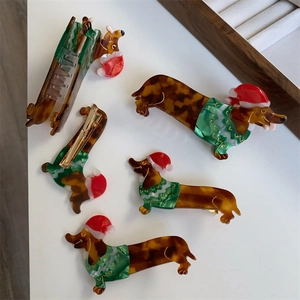 Detail of Christmas dachshund hair clips set in colorful acetate material for women