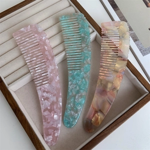 Elegant thick acetate resin hair combs with marbled stone pattern in pink and blue colors
