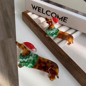 Festive dachshund dog hair claw clips with Christmas hat and sweater in acetate material
