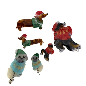 Christmas dog hair claws made of colorful acetate featuring dachshund and pug with holiday hats