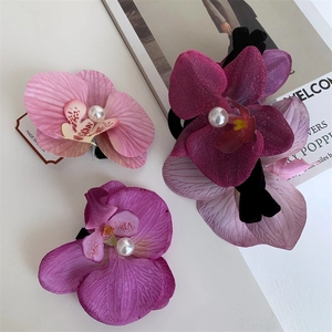 Three-piece set of realistic orchid hair clips with pearls for beach vacation styling