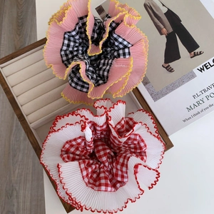 Lace-trimmed checkered oversized scrunchies set in pink and white pleated chiffon