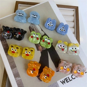 Colorful acetate monster hair claws set with cute expressions and marble texture