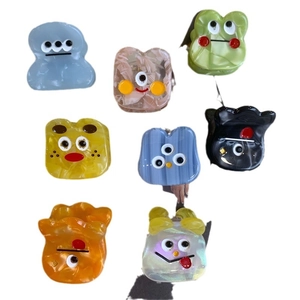 Colorful funny monster acetate hair claws set with cute cartoon faces and marble texture
