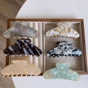 Tortoise shell acetate hair claw clips in various colors and marble textures for women