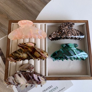 Set of five large acetate hair claw clips in pearl pink, emerald green, and tortoiseshell