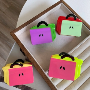 Chic acetate hair claw clips in mini handbag shape with vibrant color block design