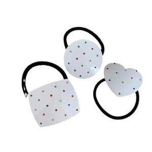 Three-piece rhinestone hair ties set with heart, circle, and square shapes on black bands