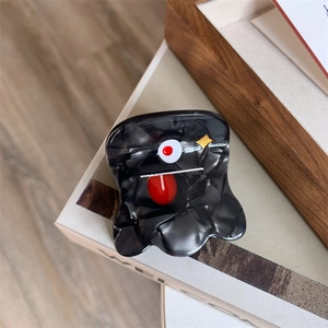 Detail of quirky monster hair claw clip featuring acetate texture and cartoon face design