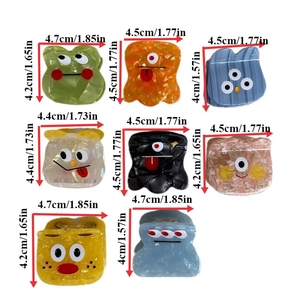 Cartoon acetate hair claws in various funny monster shapes and colorful designs