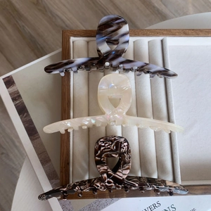 Three-piece acetate claw clip set with marble patterns and pearlescent finish