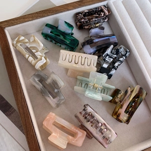 Variety of vintage-style square acetate hair claws in marble and tortoiseshell patterns