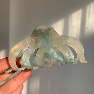 Iridescent acetate hair claw clip with octopus design in soft pearlescent finish