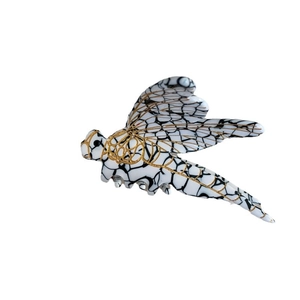 Creative dragonfly hair claw clip with black marble pattern and gold metallic wing details