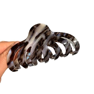 Large tortoiseshell acetate claw clip for thick hair with marble texture and octopus design