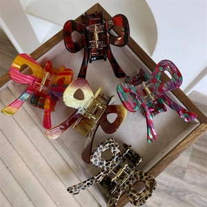 Medium acetate bow hair clips in plaid, rainbow, marble, geometric and leopard patterns
