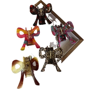 5-piece colorful bow acetate hair claws with checkered, floral, and leopard print patterns