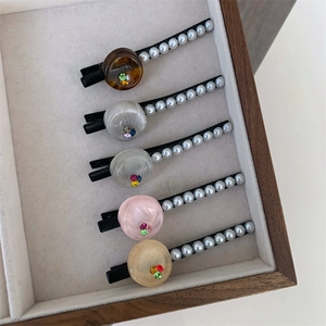 Set of five elegant resin hair clips with faux pearls and colorful rhinestones
