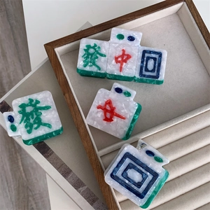 Chinese mahjong style hair claw clip in white marble pattern with green accents