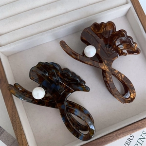Gingko leaf acetic acid hair claws with white pearls in amber marble textures
