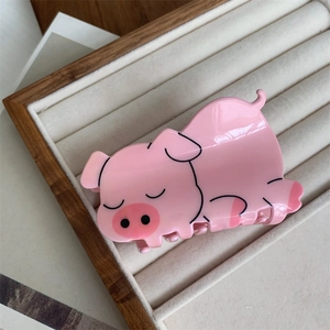 Cute pink pig claw clip made of glossy acrylic with sleeping cartoon animal design