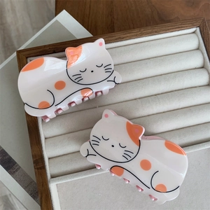 Cute cream cat hair claws set with orange spots made of glossy acrylic resin