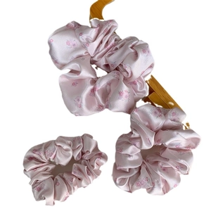 Three-piece set of floral satin scrunchies featuring vintage pink and purple flower patterns
