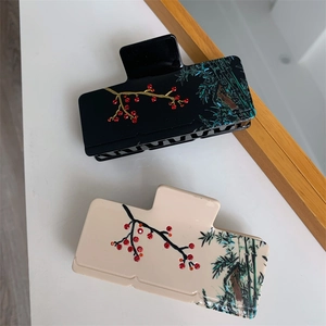 Détails de pinces à cheveux de style chinois avec motifs prunier et bambou