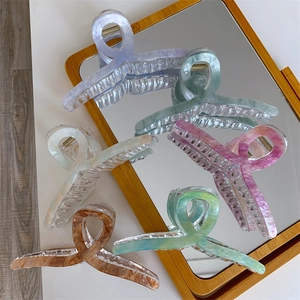 Detail showing assorted marble texture hair claws with strong metal spring mechanism