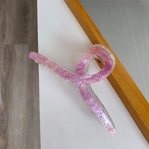 Detail of 13cm marble texture acrylic hair claw clip with elegant pearlescent finish