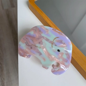 Detail of pink and purple acetate elephant hair claw clip with marble texture