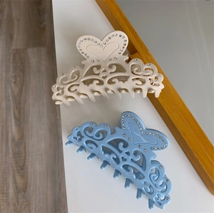 Hollow heart acetate hair claw clips with rhinestones in beige and light blue set