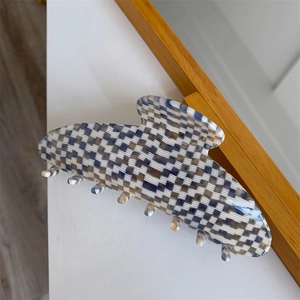 Detail showing high quality blue and white checkerboard acetate hair claw clip