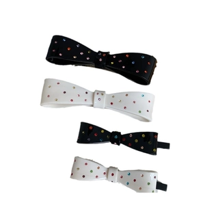 Set of four butterfly bow hair clips with colorful rhinestones in black and white styles