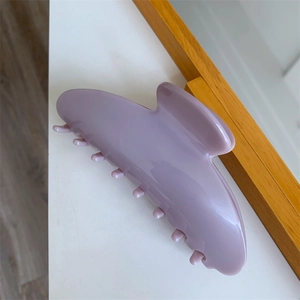 Detail view of large lavender acetate shark clip with glossy finish and durable teeth