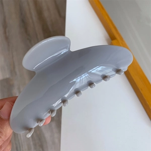 Detailed view of large grey-purple acetic hair claw clip with glossy finish