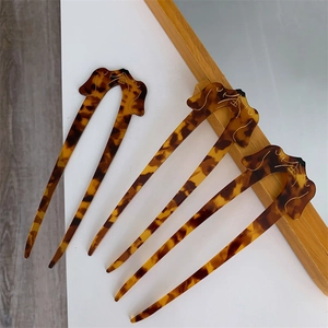 Three tortoiseshell dachshund hair pins in creative U-shape design for long hair styling