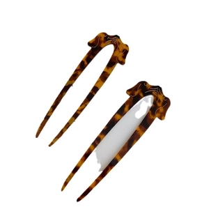 Minimalist tortoiseshell U-shaped hair pins with sleek animal silhouette design